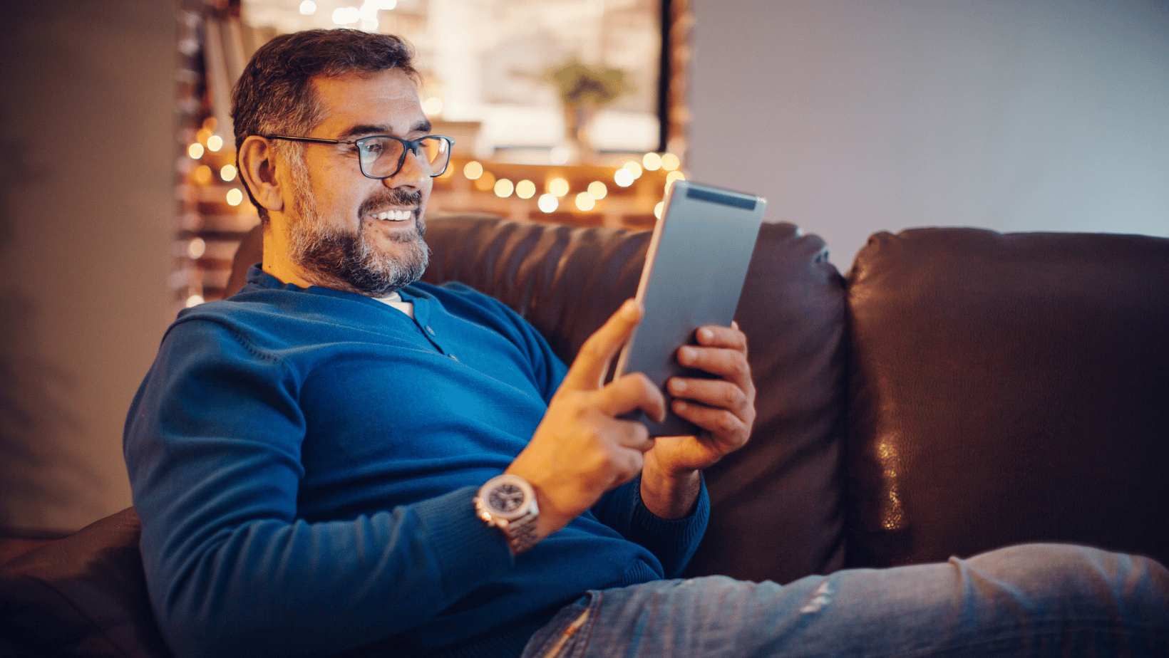 Man playing on his ipad with fast internet speeds